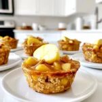 Die Hauptzutaten sind entscheidend für den Geschmack der Muffin Cups. Hier sind sie: - 2 Tassen Haferflocken - 1 Teelöffel Backpulver - 1 Teelöffel gemahlener Zimt - 1/2 Teelöffel Salz - 2 Tassen Mandelmilch - 1/4 Tasse Ahornsirup oder Honig - 2 Äpfel, geschält und gewürfelt - 1 Teelöffel Vanilleextrakt Jede Zutat hat ihre Rolle. Haferflocken geben die Basis. Backpulver sorgt für Auftrieb. Zimt und Salz bringen Geschmack. Mandelmilch macht die Mischung cremig. Der Süßstoff rundet alles ab. Die Äpfel fügen Frische hinzu, während der Vanilleextrakt für Tiefe sorgt. Die Mengen sind wichtig. Sie sorgen dafür, dass die Muffin Cups die richtige Textur haben. Zum Beispiel, zu viele Haferflocken machen die Muffins trocken. Zu wenig Backpulver verhindert, dass sie aufgehen. Es ist wichtig, die richtigen Verhältnisse zu finden, um die perfekte Konsistenz zu erreichen. Du kannst die Muffin Cups mit einigen optionalen Zutaten aufpeppen: - 1/4 Tasse Rosinen oder getrocknete Cranberries - 1/4 Tasse gehackte Walnüsse oder Pekannüsse Diese Zutaten bringen zusätzliche Aromen und Texturen. Rosinen oder Cranberries fügen Süße hinzu. Nüsse bringen einen knackigen Biss. Du kannst sie nach deinem Geschmack hinzufügen. So machst du die Muffin Cups noch interessanter und leckerer. Zuerst heize den Ofen auf 175°C vor. Fette dann ein Muffinblech ein oder lege es mit Förmchen aus. Das macht das Herausnehmen leichter und verhindert das Anhaften. Sammle deine Zutaten: Haferflocken, Backpulver, Zimt, Salz, Mandelmilch, Ahornsirup, Äpfel, Rosinen und Nüsse. Es ist wichtig, alles bereit zu haben, bevor du anfängst. So geht nichts schief. In einer großen Schüssel vermischst du die Haferflocken, das Backpulver, den Zimt und das Salz. Rühre alles gut um. In einer anderen Schüssel verquirlst du die Mandelmilch, den Ahornsirup und den Vanilleextrakt. Gieße die feuchte Mischung zu den trockenen Zutaten. Rühre vorsichtig, bis alles gerade so vermischt ist. Das sorgt für eine perfekte Textur. Füge die gewürfelten Äpfel, Rosinen und Nüsse hinzu. Mische alles vorsichtig, damit die Stücke gleichmäßig verteilt sind. Fülle die Muffinförmchen etwa zu 3/4. Backe die Muffin Cups 25 bis 30 Minuten. Sie sind fertig, wenn die Oberseite goldbraun ist und ein Zahnstocher sauber herauskommt. Lass sie nach dem Backen kurz abkühlen, bevor du sie auf ein Gitterrost legst. So bleiben sie schön saftig und frisch. Um die besten Muffin Cups zu machen, achte auf die Mischung. Mische die trockenen Zutaten gut. So vermeidest du Klumpen. Füge die feuchten Zutaten langsam hinzu. Rühre nur kurz, damit die Muffins fluffig bleiben. Zu viel Rühren macht sie dicht. Die Vorbereitung dauert nur 10 Minuten. Das Backen braucht 25 bis 30 Minuten. Heize den Ofen rechtzeitig vor. So sparst du Zeit. Stelle sicher, dass die Muffins goldbraun sind. Ein Zahnstocher muss sauber herauskommen. Das zeigt, dass sie fertig sind. Falls du auf Zucker verzichten möchtest, nutze Stevia oder Agavendicksaft. Diese sind gesunde Alternativen. Für Milch kannst du Hafermilch oder Kokosmilch verwenden. Das passt gut zu den Aromen. Diese Optionen sind auch für Veganer geeignet. {{image_4}} Du kannst die Apfel-Zimt Haferflocken Muffin Cups ganz nach deinem Geschmack gestalten. Füge frische oder gefrorene Beeren hinzu. Himbeeren und Blaubeeren passen gut. Diese Beeren bringen eine schöne Säure und Farbe. Du kannst auch Bananen verwenden. Diese machen die Muffins noch süßer und saftiger. Ein weiterer Tipp: Probiere Birnen oder Pfirsiche. Sie ergänzen den Apfelgeschmack perfekt. Wenn du Nüsse meiden möchtest, lass sie einfach weg. Die Muffins sind trotzdem lecker. Um glutenfreie Muffins zu machen, wähle glutenfreie Haferflocken. Achte darauf, dass die Haferflocken als glutenfrei gekennzeichnet sind. So kannst du sicher sein, dass sie keine glutenhaltigen Stoffe enthalten. So genießt jeder diese Muffins. Zimt ist der Star in diesem Rezept, aber du kannst mehr Gewürze hinzufügen. Muskatnuss gibt den Muffins einen warmen, würzigen Geschmack. Füge nur eine Prise hinzu, damit es nicht zu stark wird. Auch Ingwer passt gut. Er bringt einen frischen Kick. Für eine besondere Note kannst du auch etwas Kakaopulver einrühren. So wird der Geschmack noch interessanter. Experimentiere mit den Gewürzen, um deine eigene Mischung zu finden. Um die Apfel-Zimt Haferflocken Muffin Cups frisch zu halten, lasse sie zuerst abkühlen. Wenn sie abgekühlt sind, lege sie in einen luftdichten Behälter. Du kannst die Muffin Cups auch einfrieren. Wickele jeden Muffin in Frischhaltefolie und lege sie in einen Gefrierbeutel. So bleiben sie bis zu drei Monate frisch. Achte darauf, die Muffin Cups gut zu beschriften, damit du weißt, wann du sie gemacht hast. Lagere die Muffin Cups an einem kühlen, trockenen Ort. Stelle sicher, dass der Behälter gut verschlossen ist. So bleiben sie saftig und lecker. Wenn du sie innerhalb von ein paar Tagen verzehrst, kannst du sie auch im Kühlschrank aufbewahren. Das hilft, sie frisch zu halten, besonders wenn es warm ist. Zum Wiedererwärmen lege die Muffin Cups auf einen Teller. Mikrowelle sie für 20 bis 30 Sekunden, bis sie warm sind. Alternativ kannst du sie auch im Ofen bei 175°C für etwa 10 Minuten aufwärmen. So werden sie wieder schön warm und weich. Serviere sie mit einem Hauch von Zimt oder einem Spritzer Ahornsirup für mehr Geschmack. Die Muffin Cups halten sich gut für etwa fünf Tage. Lagere sie in einem luftdichten Behälter. So bleiben sie frisch und lecker. Du kannst sie auch im Kühlschrank aufbewahren. Dies hilft, ihre Haltbarkeit zu verlängern. Wenn du sie länger aufbewahren möchtest, friere sie ein. In einem Gefrierbeutel bleiben sie bis zu drei Monate gut. Ja, du kannst andere Früchte verwenden! Bananen, Beeren oder Pfirsiche passen perfekt. Achte darauf, die Frucht gut zu schneiden. Dies hilft, eine gleichmäßige Verteilung im Teig zu erreichen. Du kannst auch gefrorene Früchte nutzen. Sie sind praktisch und oft sehr lecker. Denke daran, die Menge an Flüssigkeit anzupassen. Zu viel Flüssigkeit kann den Teig verändern. Ja, die Muffin Cups sind kinderfreundlich! Sie sind gesund und machen Spaß. Kinder lieben den süßen Geschmack von Äpfeln und Zimt. Du kannst die Muffin Cups auch kleiner machen. So sind sie perfekt für kleine Hände. Verwende weniger Zucker, wenn du möchtest. Dies macht sie noch gesünder. Achte darauf, keine harten Nüsse für kleine Kinder zu verwenden. Die Apfel-Zimt Haferflocken Muffin Cups sind einfach und lecker. Du hast gelernt, welche Zutaten wichtig sind und wie du sie kombinierst. Unsere Schritt-für-Schritt-Anleitung hilft dir beim Backen. Die Tipps und Tricks sorgen für den perfekten Muffin. Variationen bringen neuen Geschmack und die Aufbewahrungshinweise halten sie frisch. Denk daran, dass diese Muffin Cups auch für Kinder geeignet sind. Experimentiere und finde deine Lieblingsversion! Backen macht Spaß und mit diesen Muffins begeistert jeder.